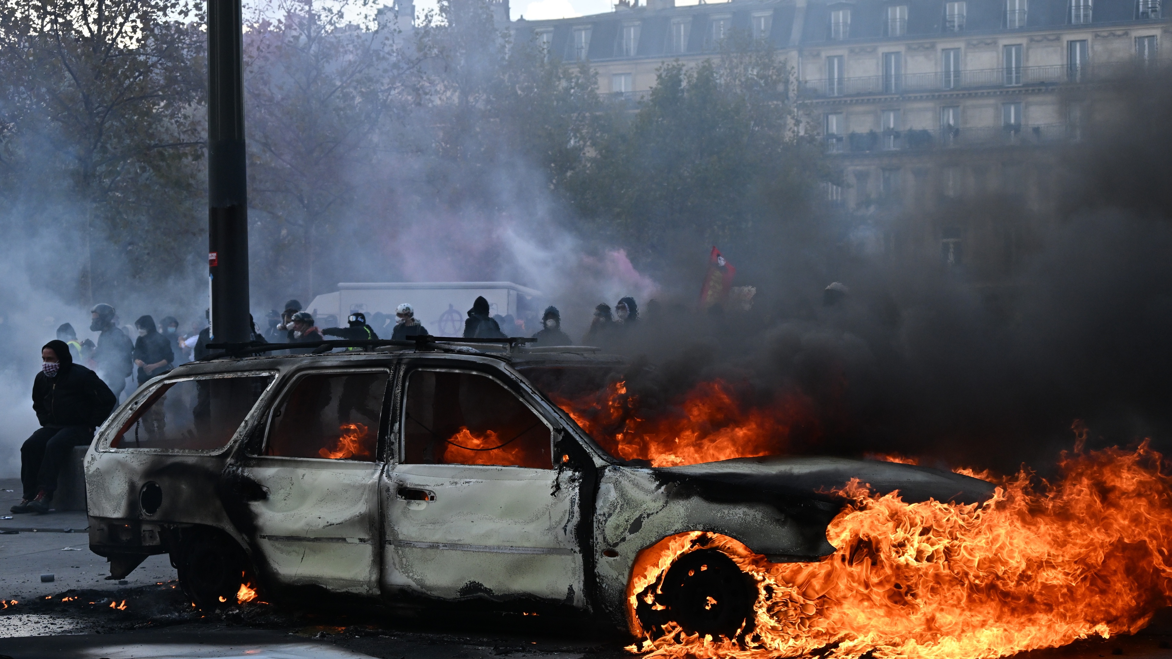 French police clash with protesters as tens of thousands rally over cost of living